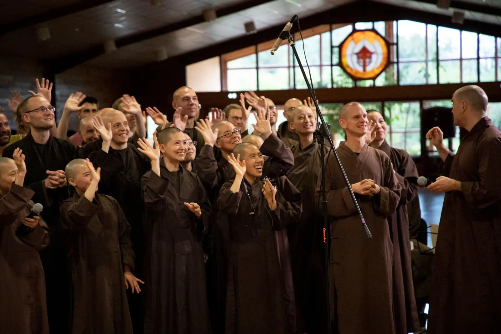 Monastics and friends waving together
