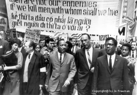 MLK with poster in Eng and VN Man is not the enemy